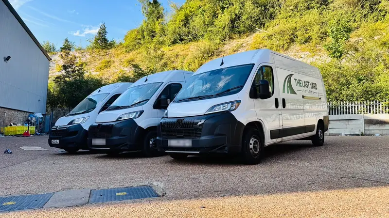 Three The Last Yard Logistics vans lined up at the depot