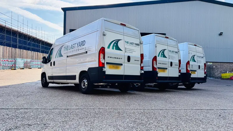 Rear doors showing The Last Yard Logistics branding and contact details